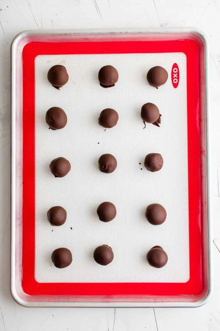 Dark Chocolate Peppermint Truffles Top down view of truffles drying on a baking sheet.