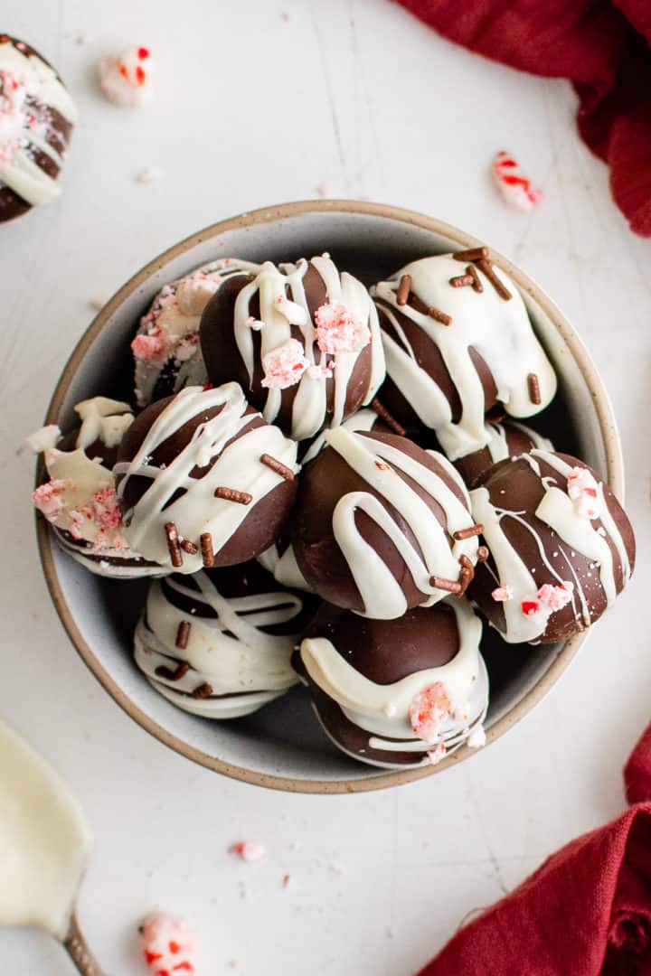 Stack of peppermint truffles on a plate.