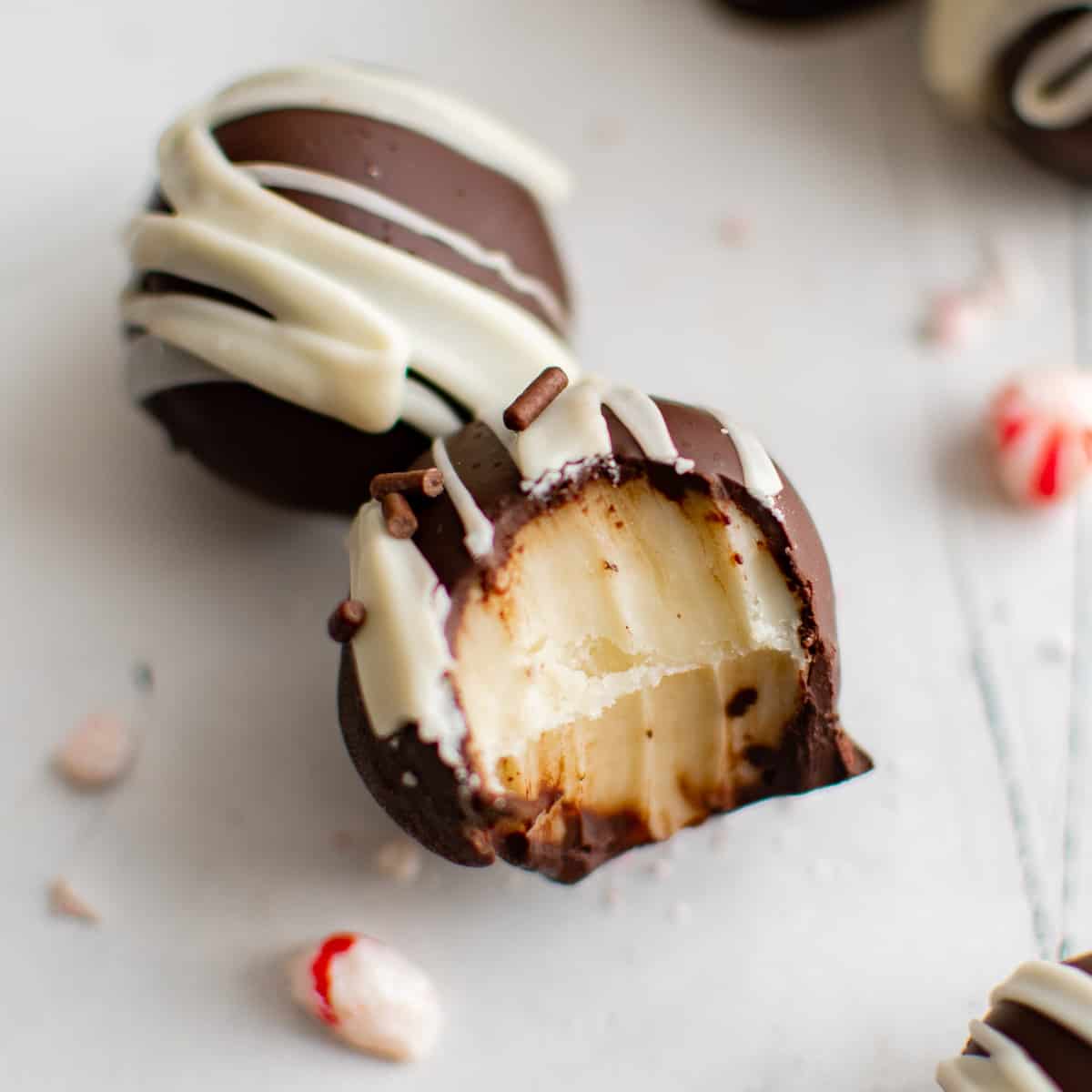 Peppermint Truffles Close up of peppermint truffles and one with a bite taken out.