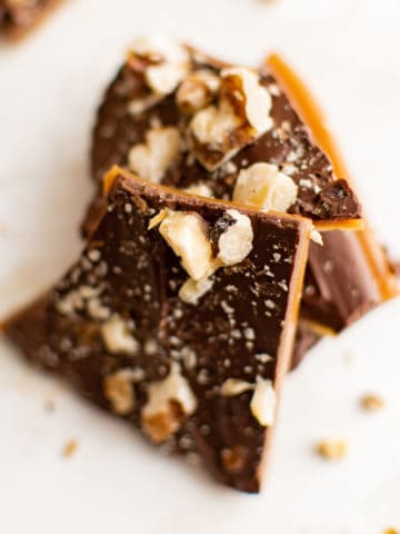 Close up view of pieces of toffee with nuts.
