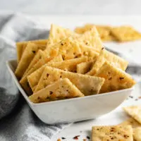 White bowl filled with spicy firecracker crackers.