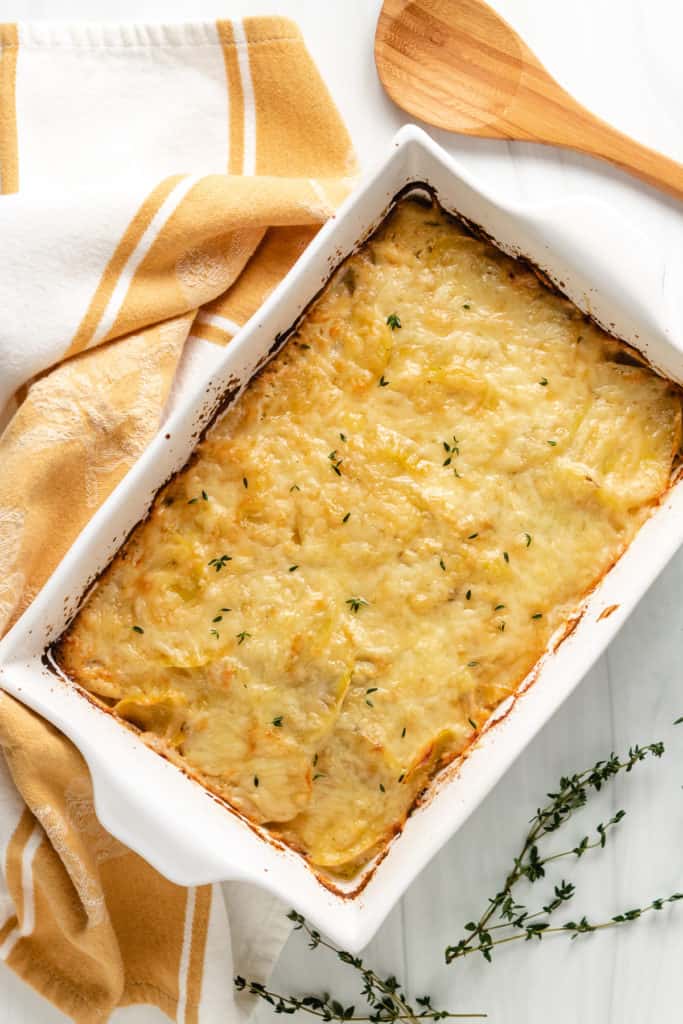 Top down view of potatoes au gratin in a baking dish.