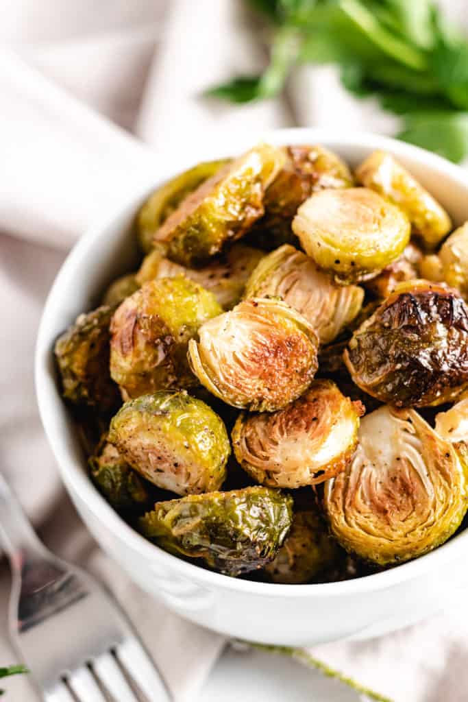 Close up view of roasted brussel sprouts in a bowl.