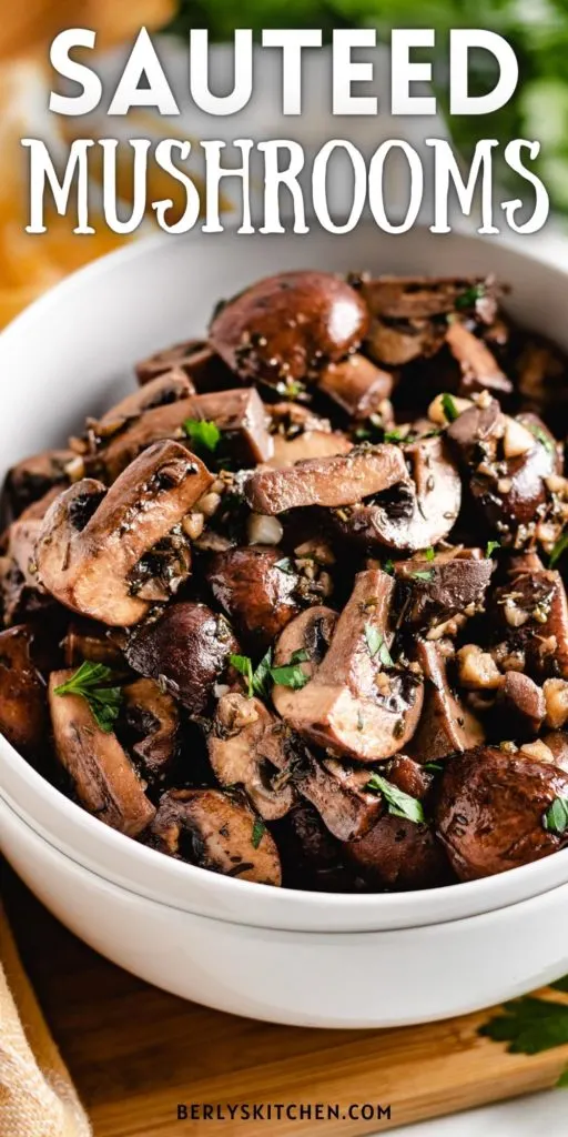 Close up of sauteed mushrooms in a pan.
