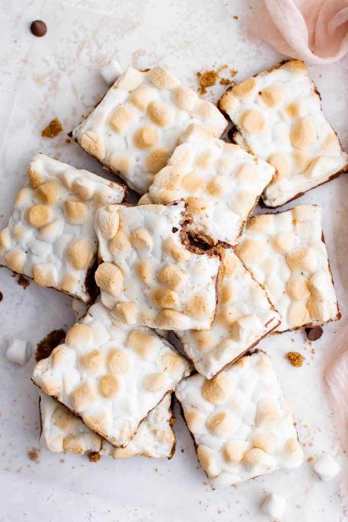 Top down view of a batch of s'mores bars with toasted marshmallows.