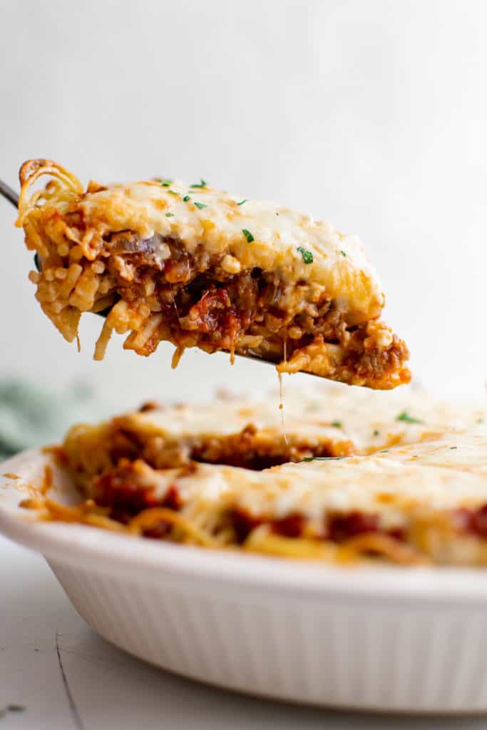 Slice of spaghetti pie on a spatula.