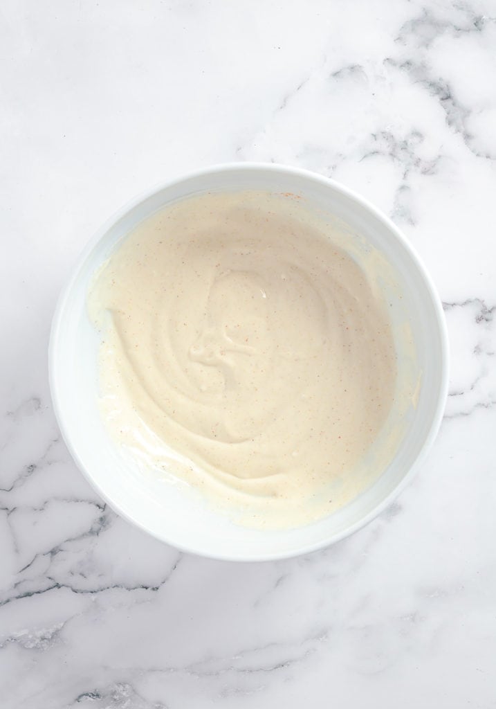 Bowl of dressing for pasta salad.