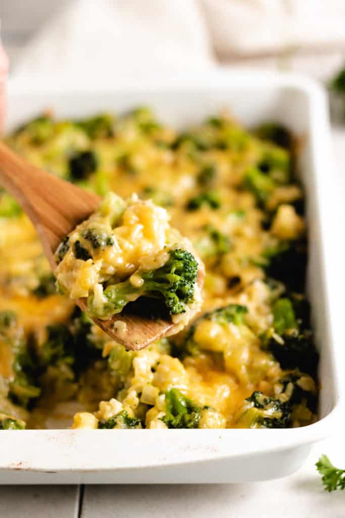 Broccoli rice casserole on a spoon.