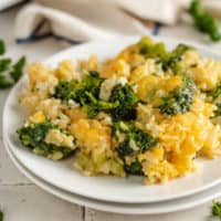 Broccoli rice casserole on two white plates.