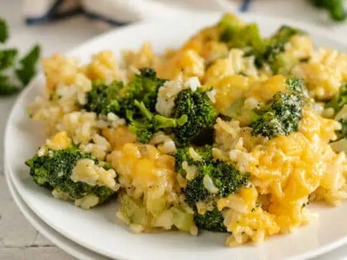 Broccoli rice casserole on two white plates.