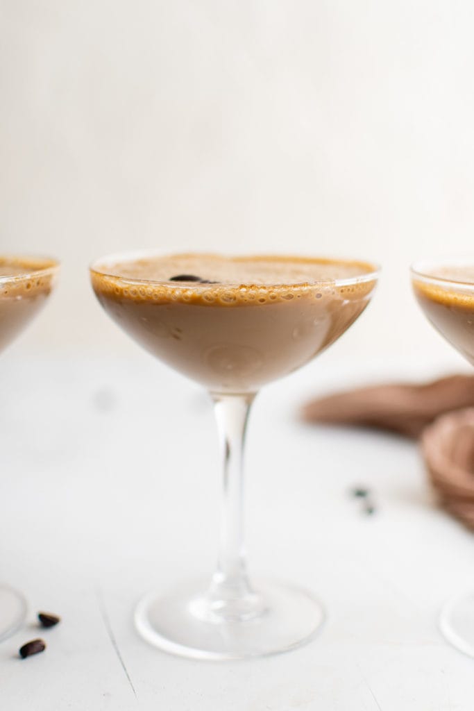 Espresso martini in a long stemmed glasses.