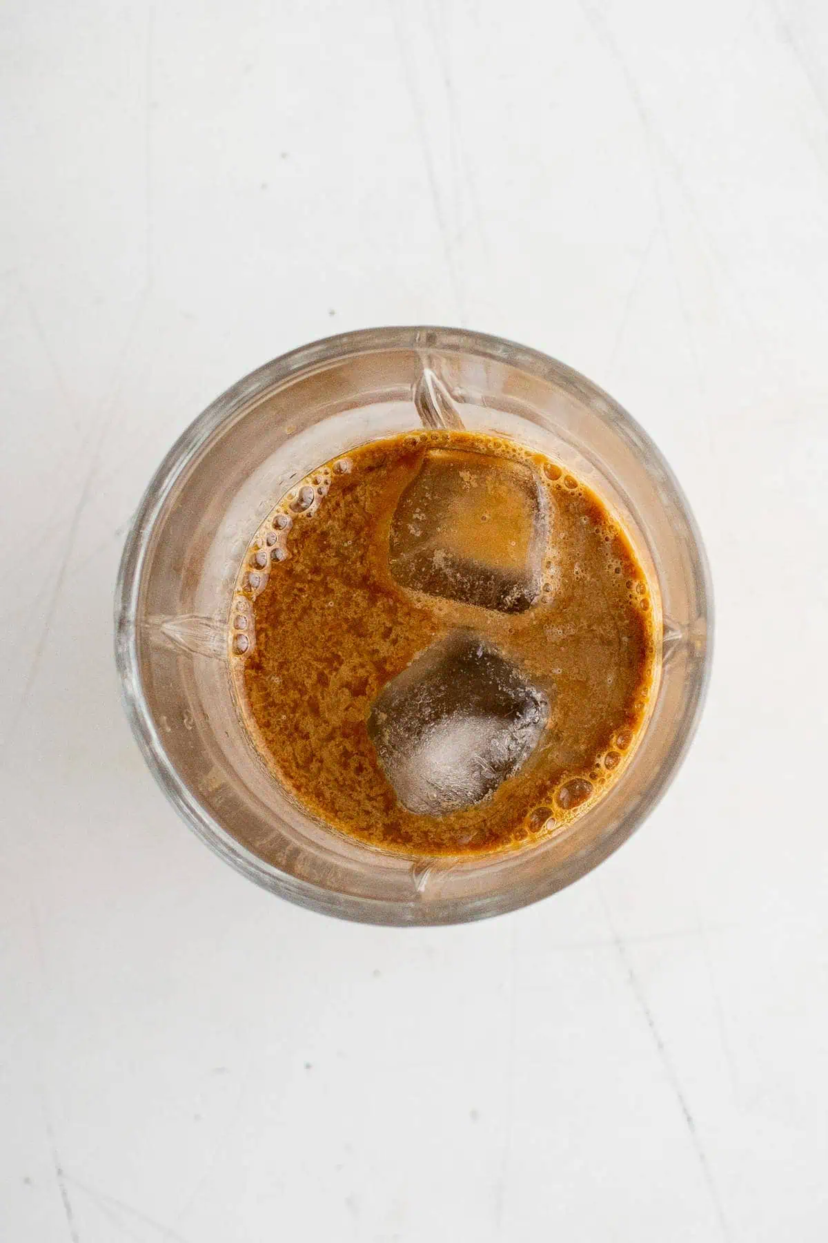Espresso and ice in a drink shaker.