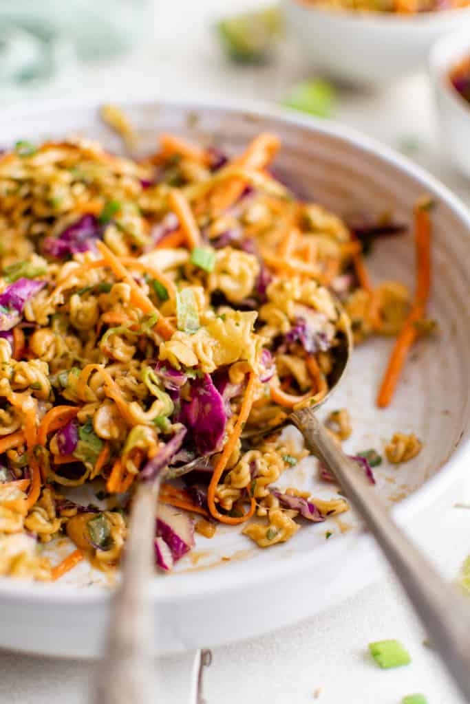 Close up view of a serving platter filled with ramen noodle salad.