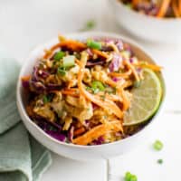 Ramen noodle salad with a lime wedge.