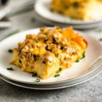 Sausage egg casserole with cheese on a dish.