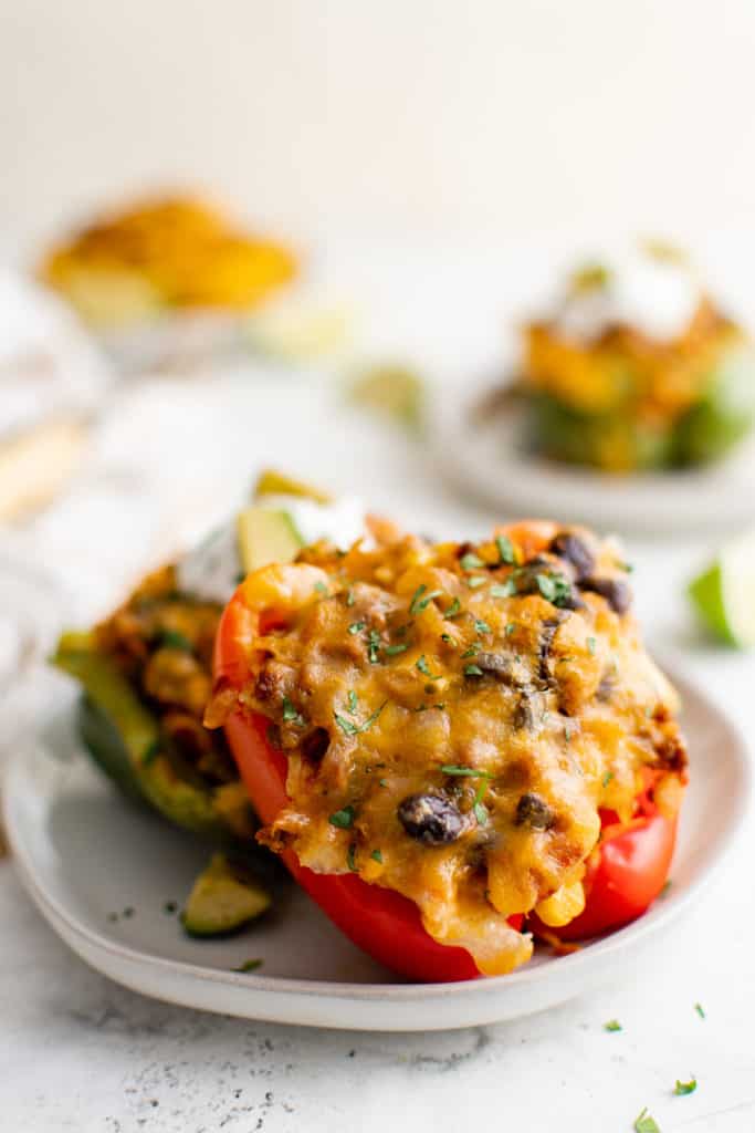 Stuffed peppers on a gray plate.