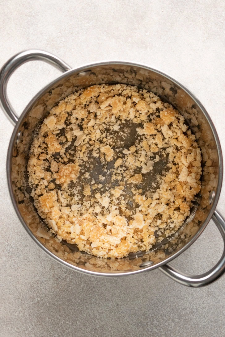 Sugar forming balls in a pan.