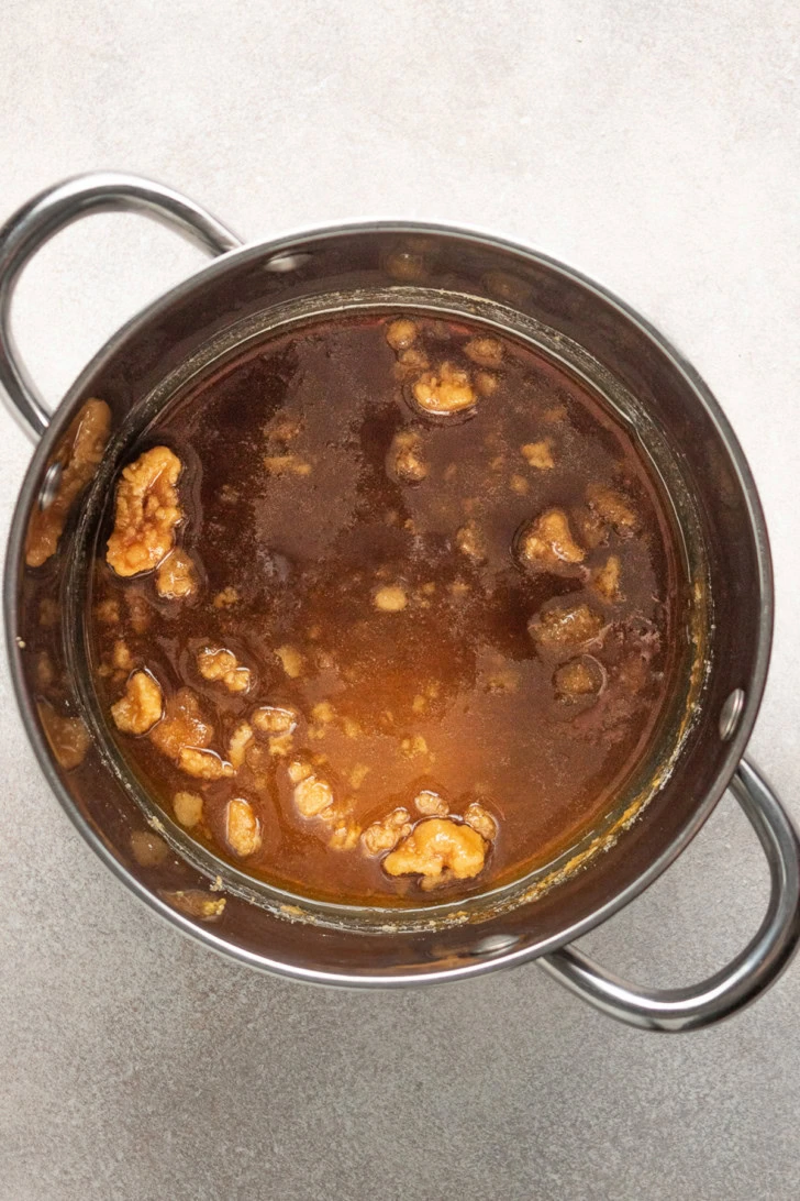 Sugar caramelizing in a pan.
