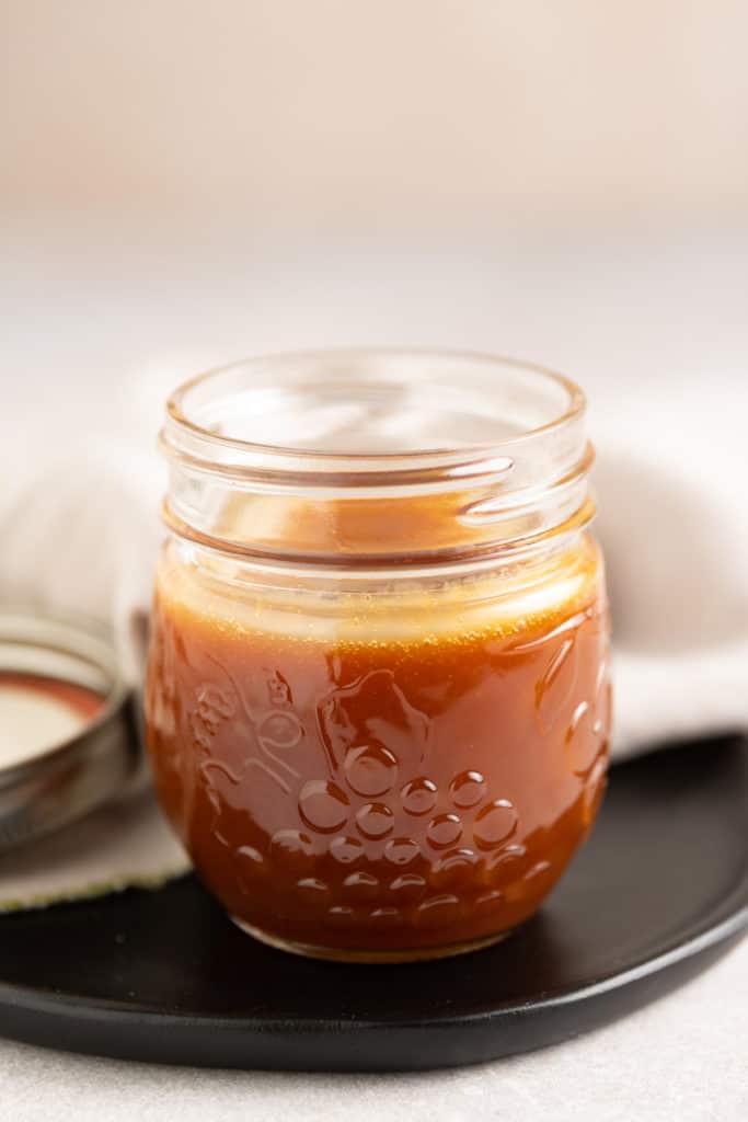 Close up of a jar of caramel.