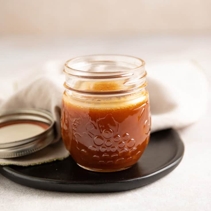 Caramel sauce in a mason jar.