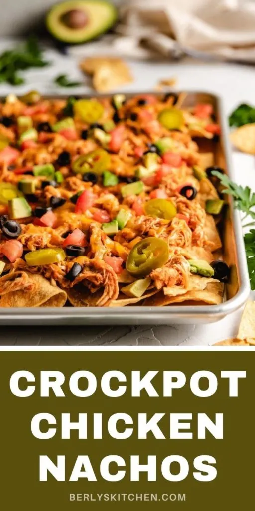 Close up of crockpot chicken nachos on a pan.