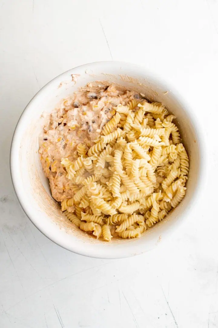 Pasta on top of casserole filling in a bowl.