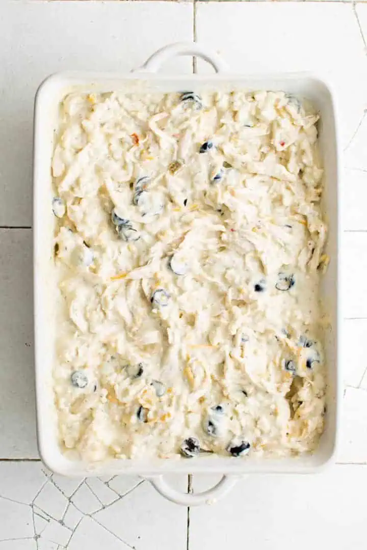 Creamy casserole filling stirred in a pan.