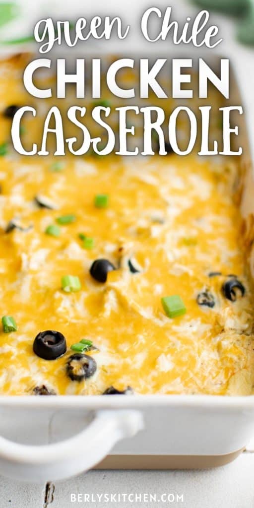 Close up of green chile chicken casserole in a baking dish.