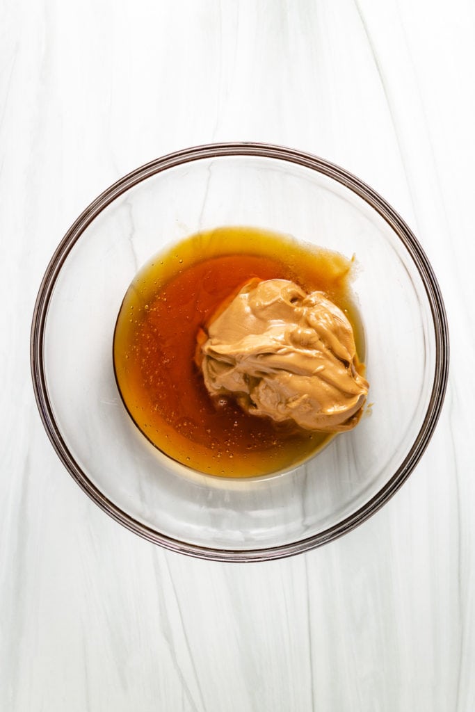 Peanut butter and honey in a bowl.