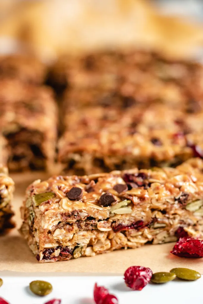 Rows of homemade granola bars on parchment paper.