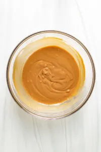 Peanut butter and honey mixed in a bowl.