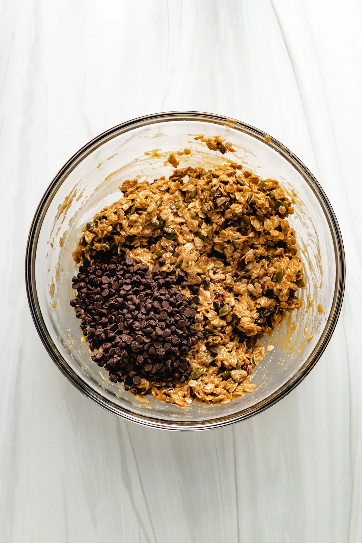 Chocolate chips added to granola bar mixture.