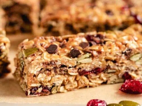 Close up view of homemade granola bars with cranberries.