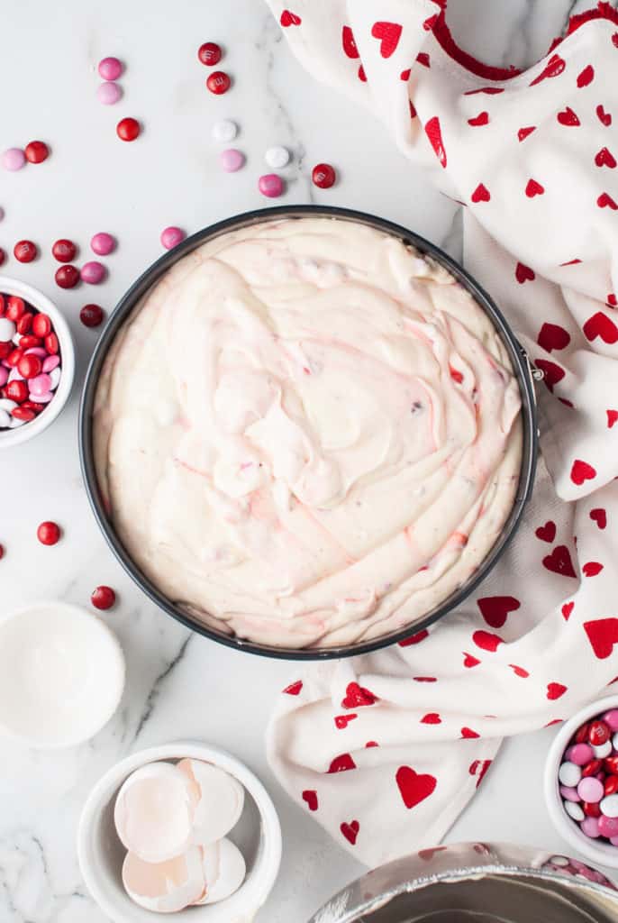 Cheesecake batter in a springform pan.