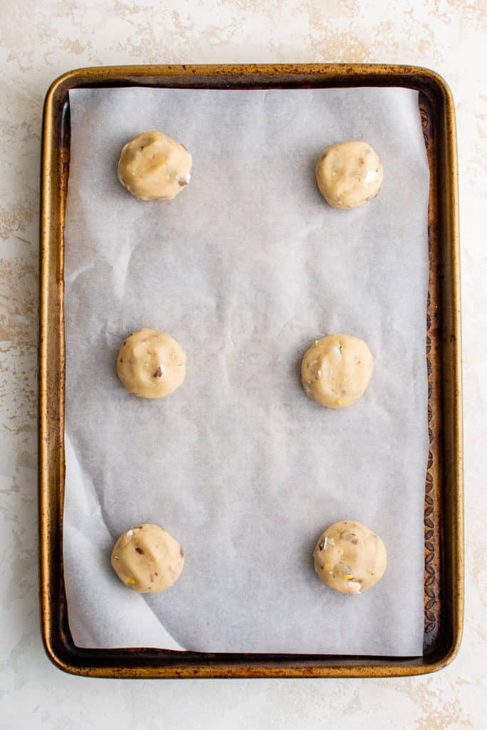 Uncooked cookies on a baking sheet.