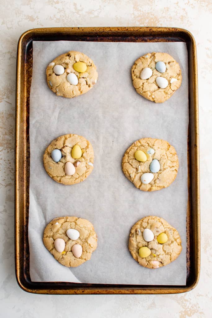 Mini egg cookies on a baking sheet.