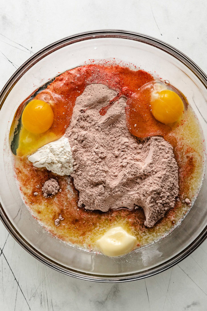 Ingredients for red velvet cake in a bowl.