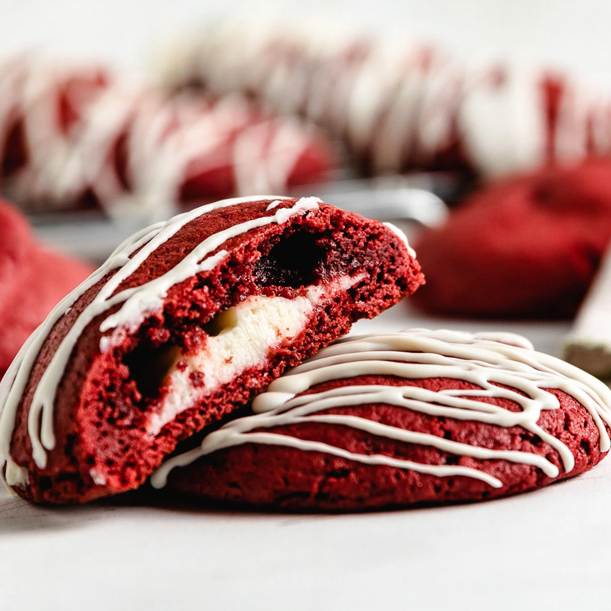 Red velvet cake mix cookie cut in half.