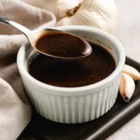 Spoon of balsamic vinaigrette.