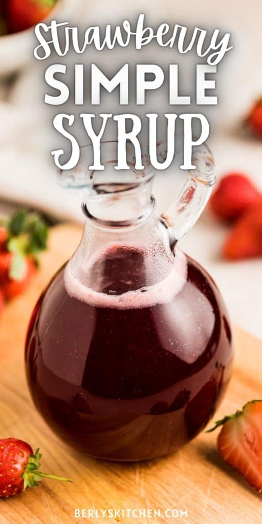 Curet of strawberry simple syrup on a board.