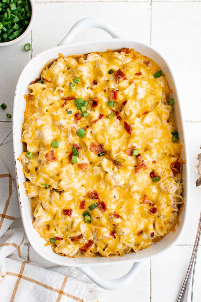 Green onions on top of cheesy chicken casserole.