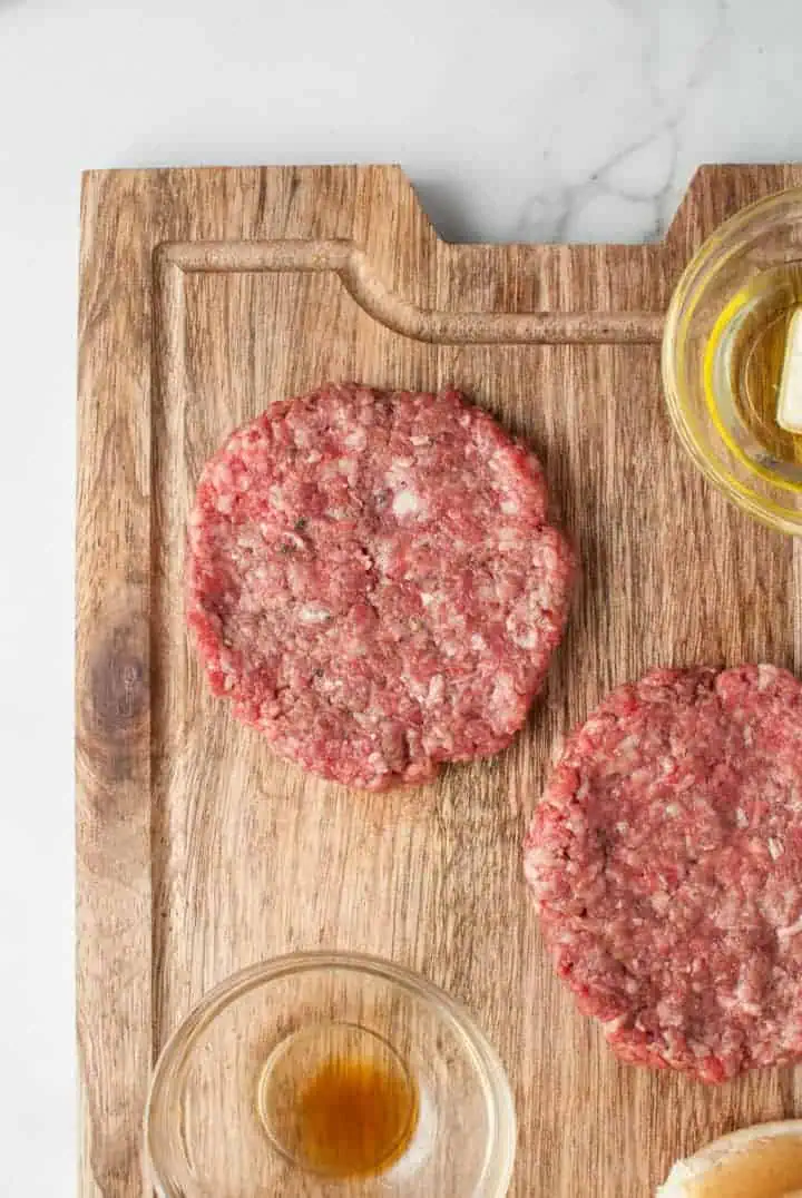 Close up view of a ground beef pattie.