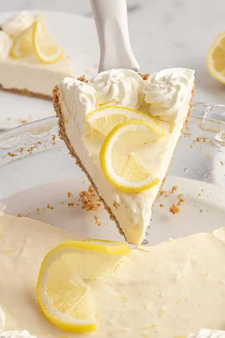 Slice of lemon icebox pie on a spatula.