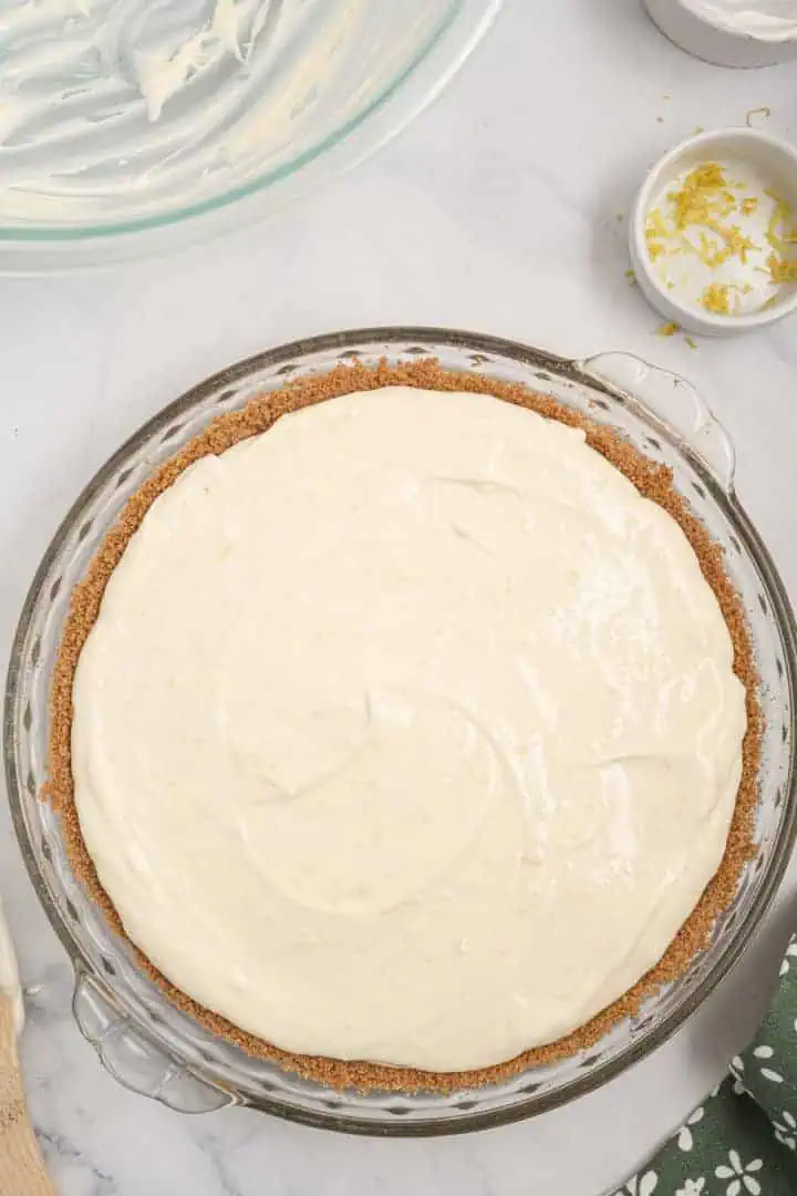Chilled lemon icebox pie in a pan.