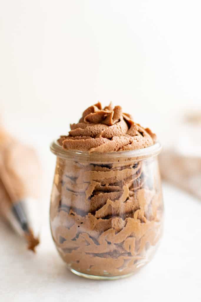 Side view of a jar of nutella frosting.