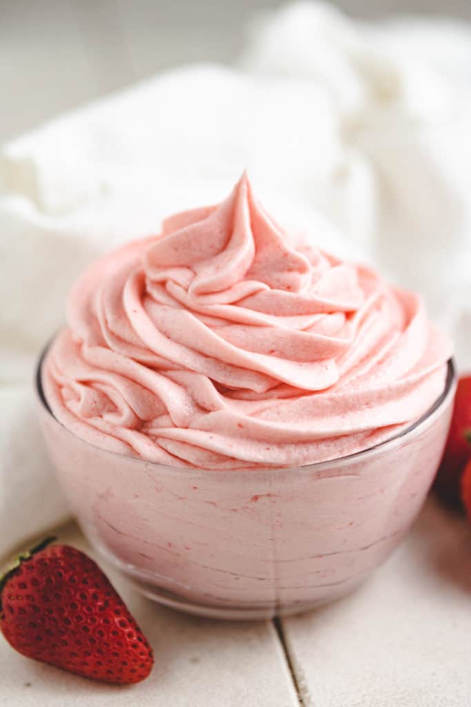 Strawberry frosting in a bowl.
