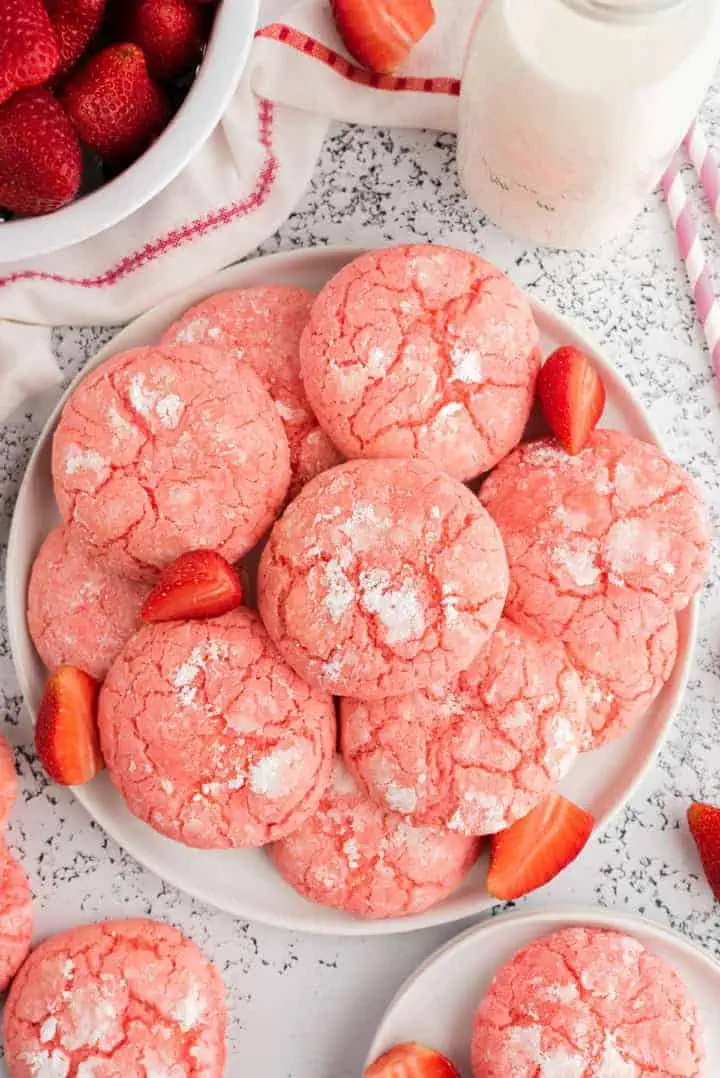 Top down view of a plate of strawberry cookies.