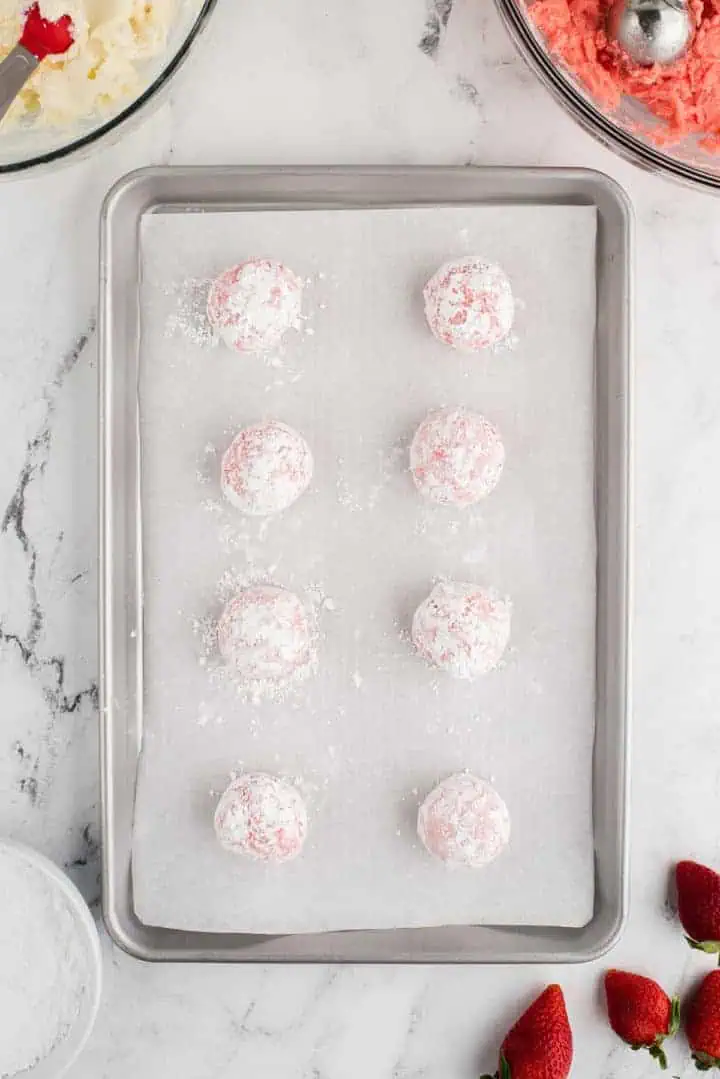 Cookie dough balls dipped in powdered sugar.