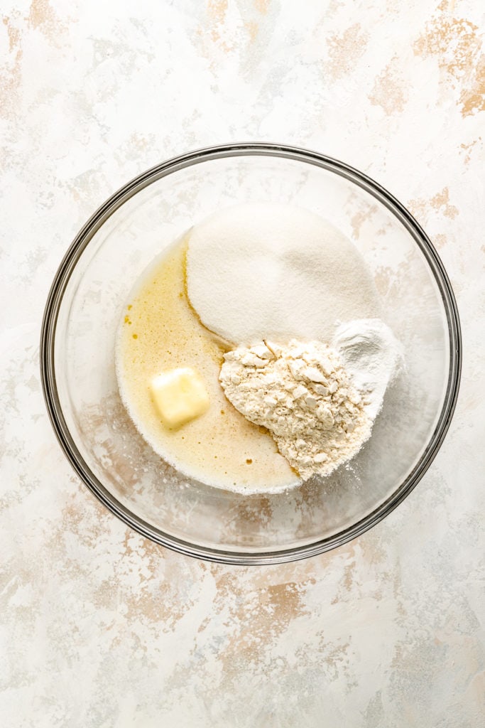 Butter, sugar, and flour in a bowl.