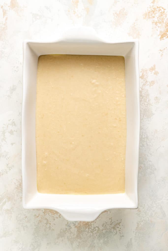 Cobbler batter in a baking dish.